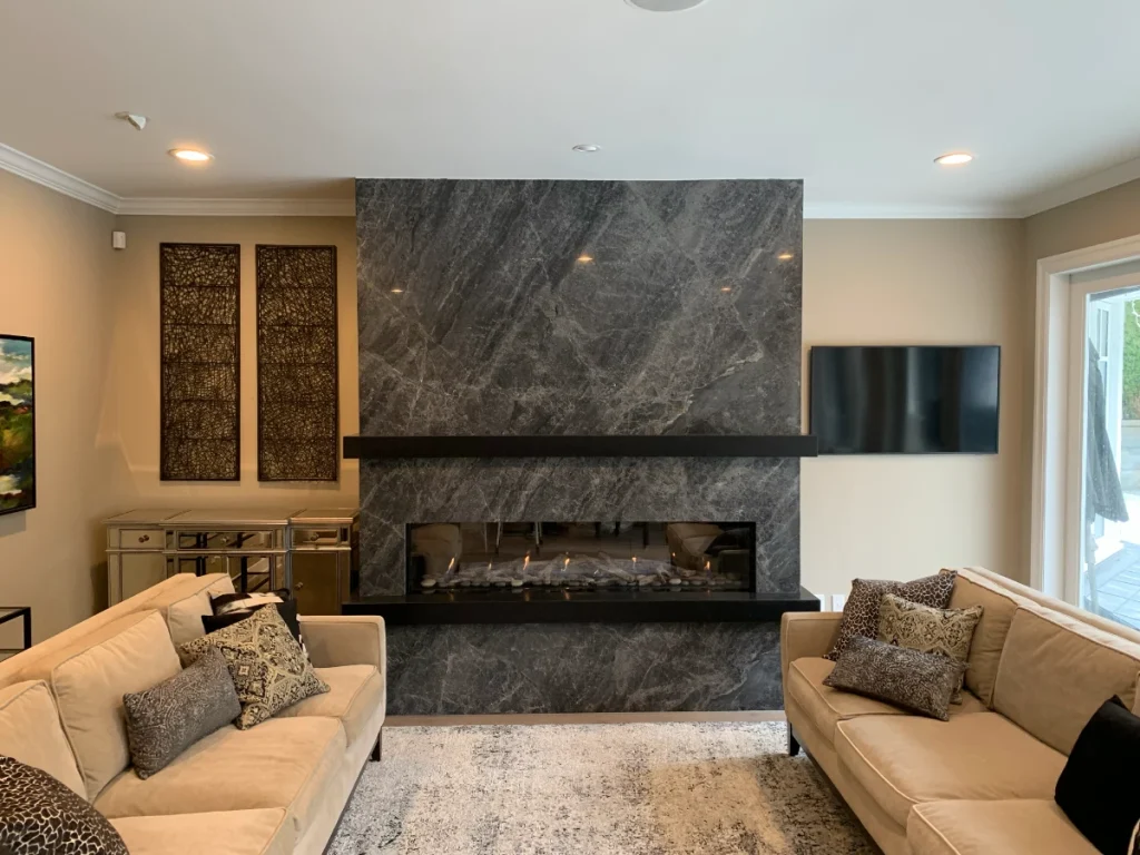 Living room fireplace with a stone surround