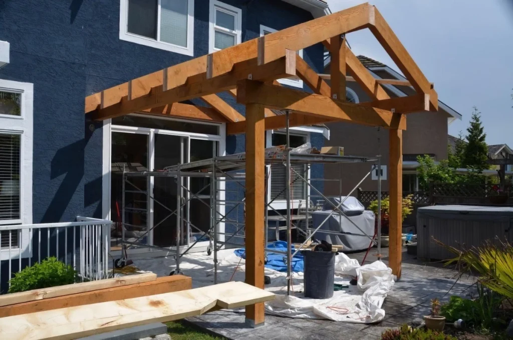 Newly installed wooden arch in the backyard of a home